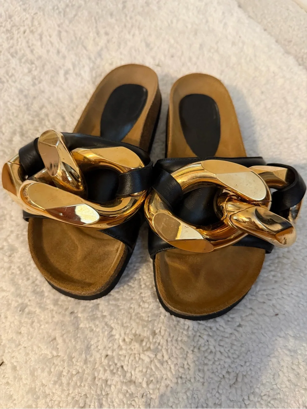 JW Anderson Women’s Black Slide Sandals with Gold Chain Accent